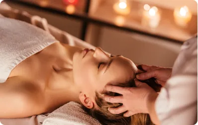 Therapist massaging a client’s shoulders and back
